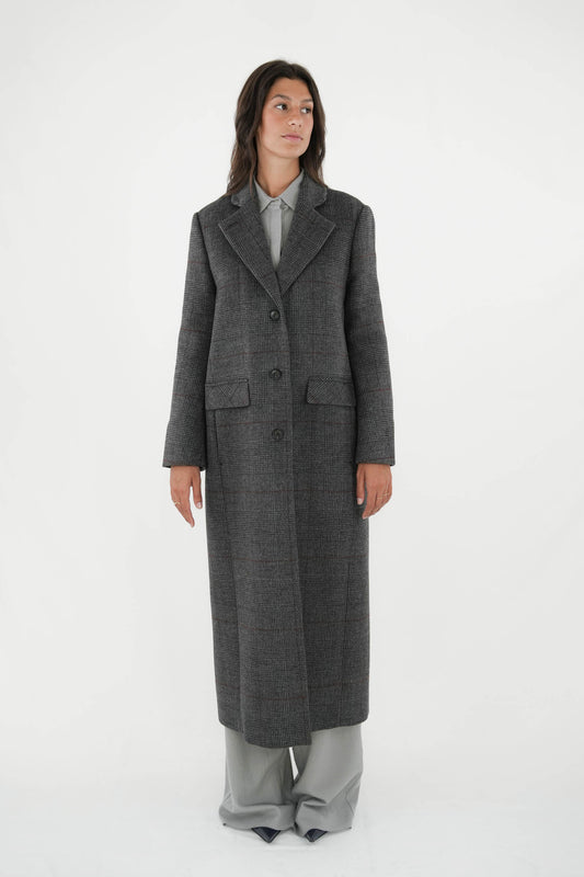 Cappotto lungo monopetto foderato in principe di galles